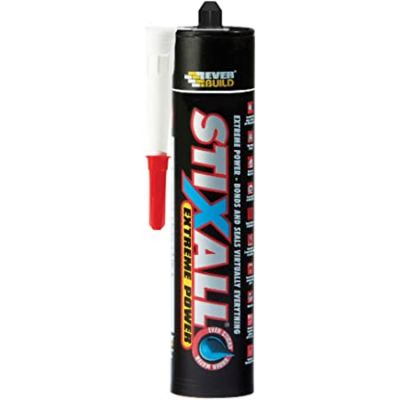 Black tube of Stixall Adhesive with applicator tip on a white background